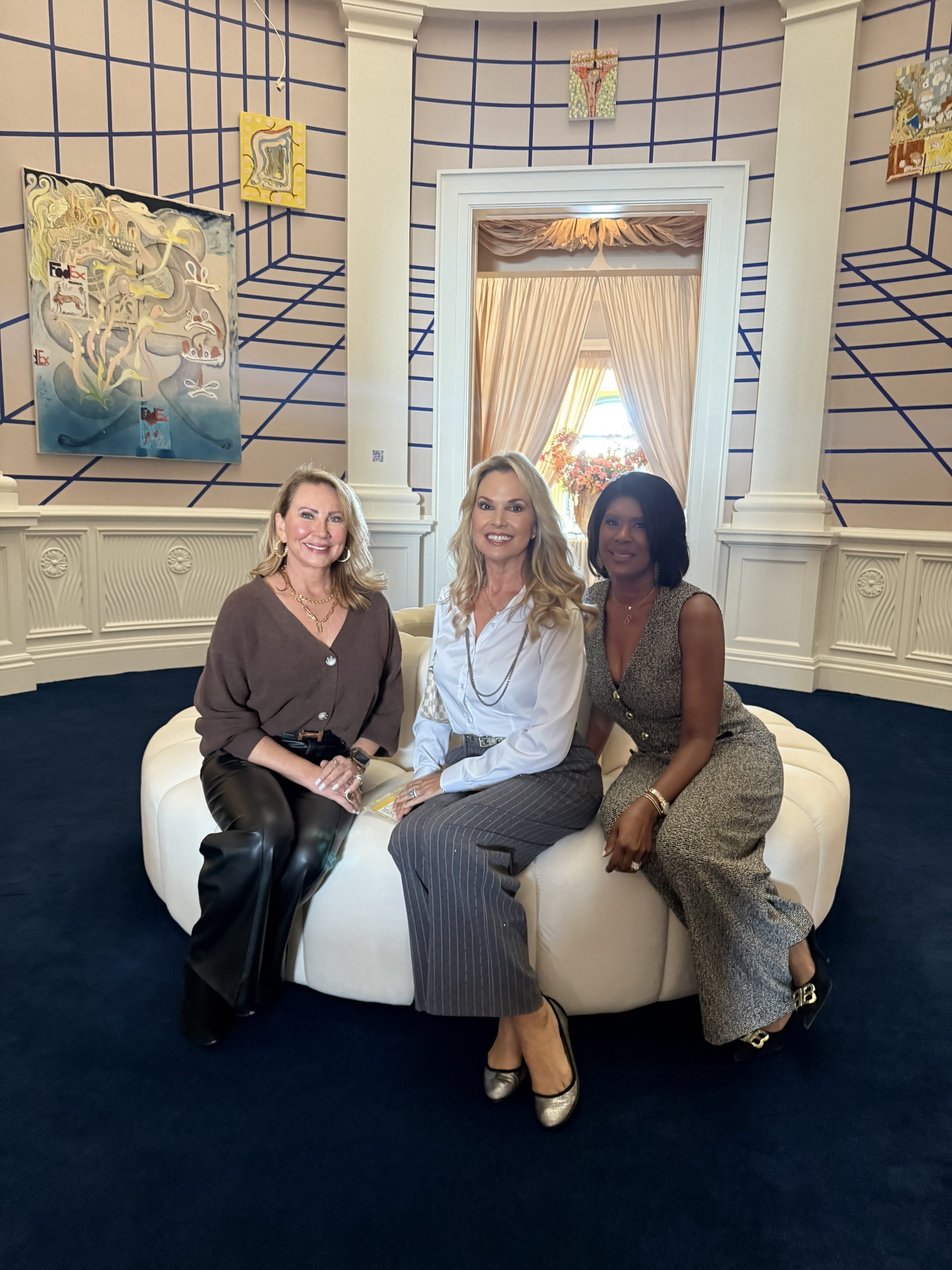 Three Jan Richey Team sales partners seated together during a luxury design tour in Dallas.