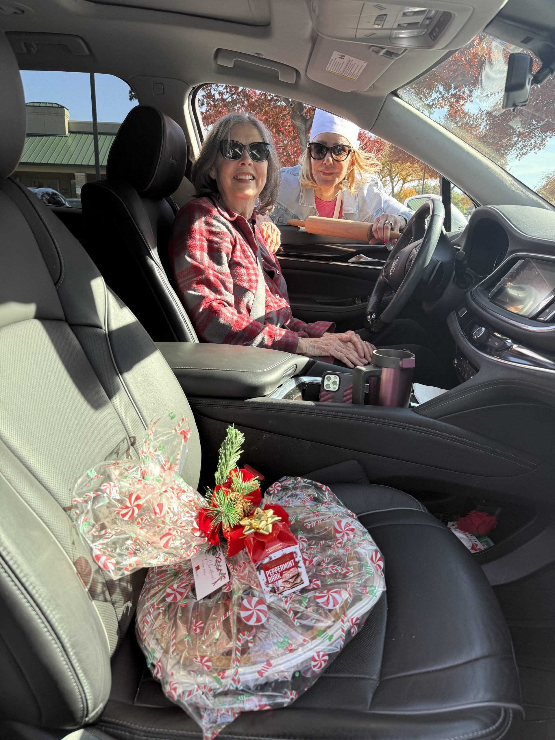 Clients picking up pies at Jan Richey Team luxury real estate holiday event