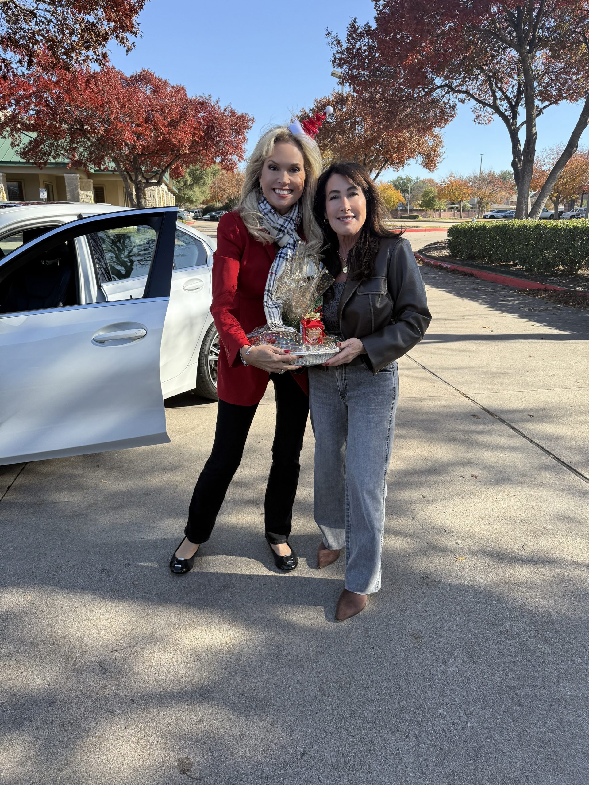 Jan Richey Team welcoming families during annual Christmas pie day in Plano TX