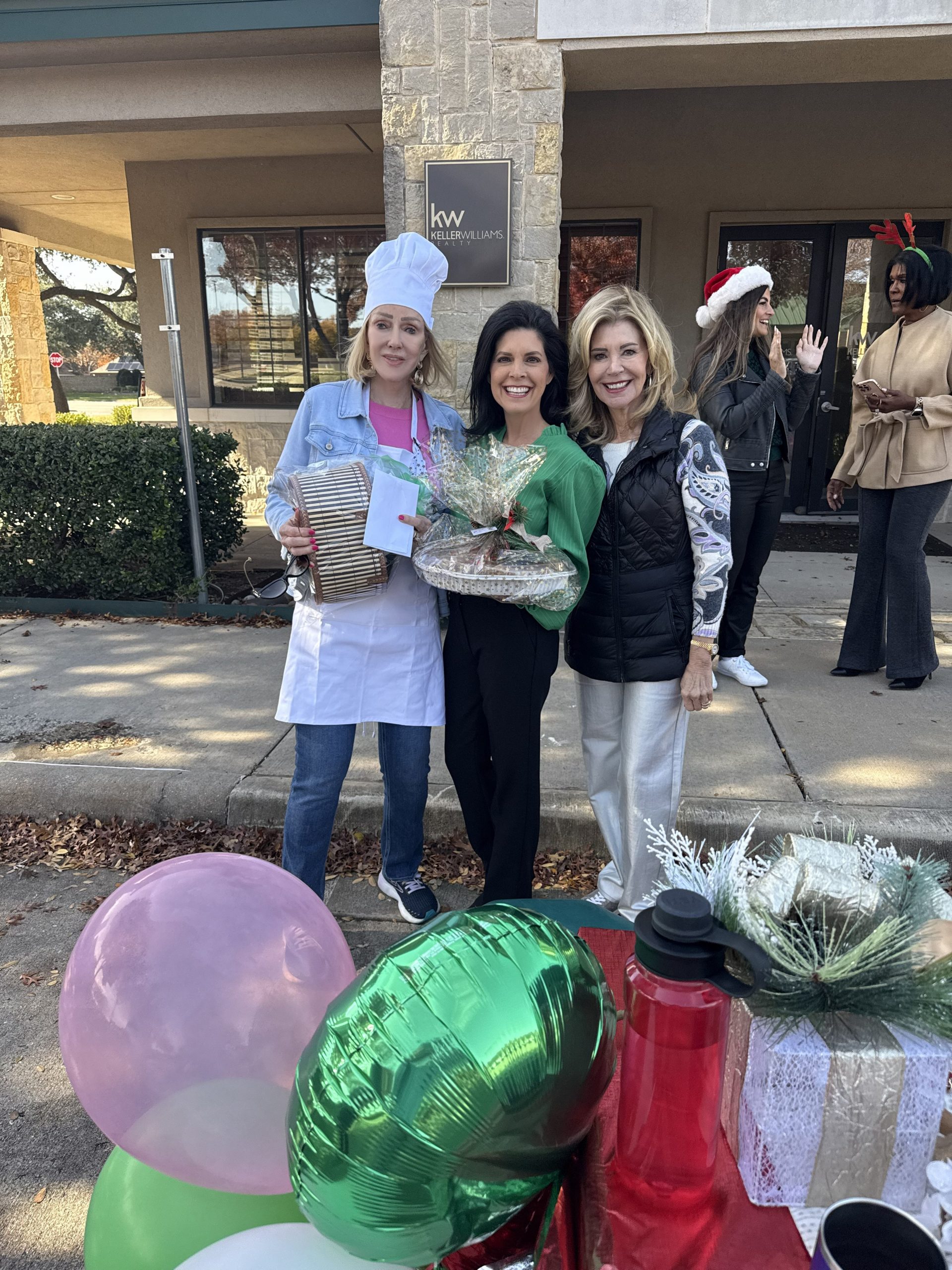 Luxury real estate team photo at Jan Richey Team holiday pie giveaway event