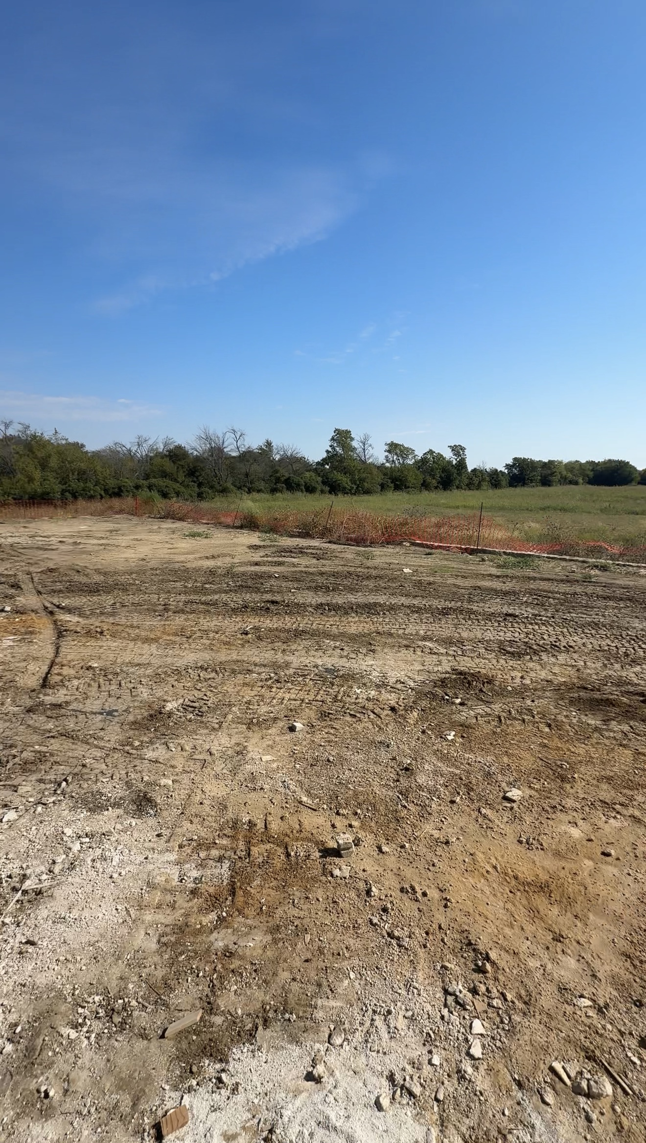 Luxury new construction backyard at the beginning stage with undeveloped land in North Dallas