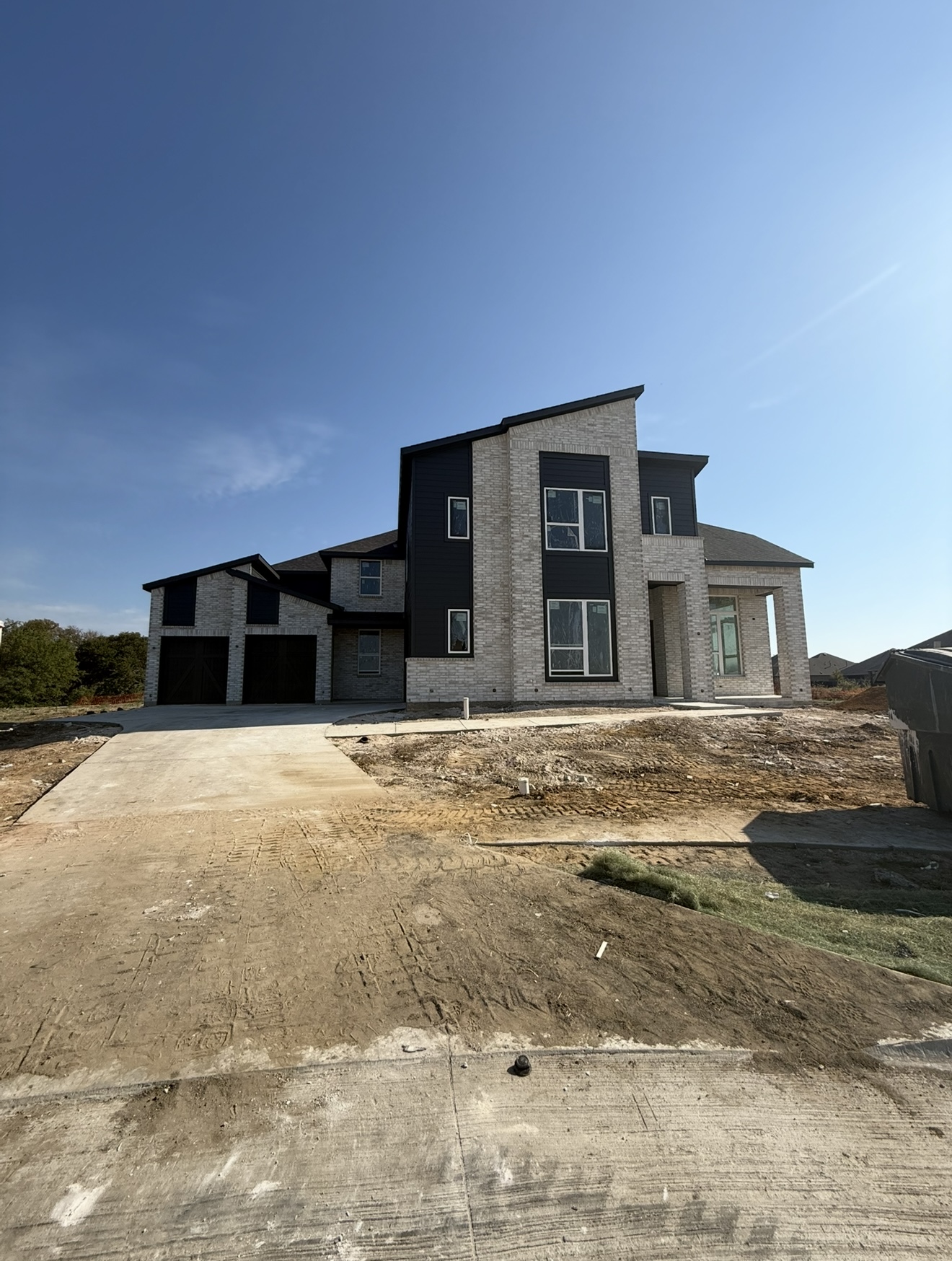 Luxury new construction home exterior midway through the build process in Texas