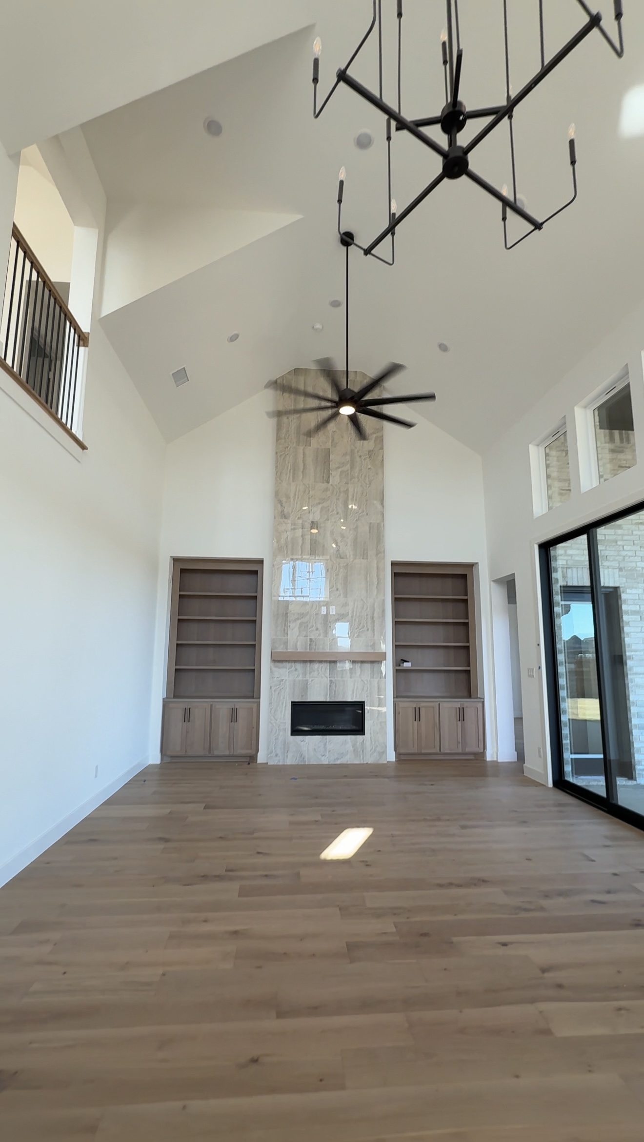 Luxury new construction living room with open layout in a high-end North Texas custom home with open-concept design