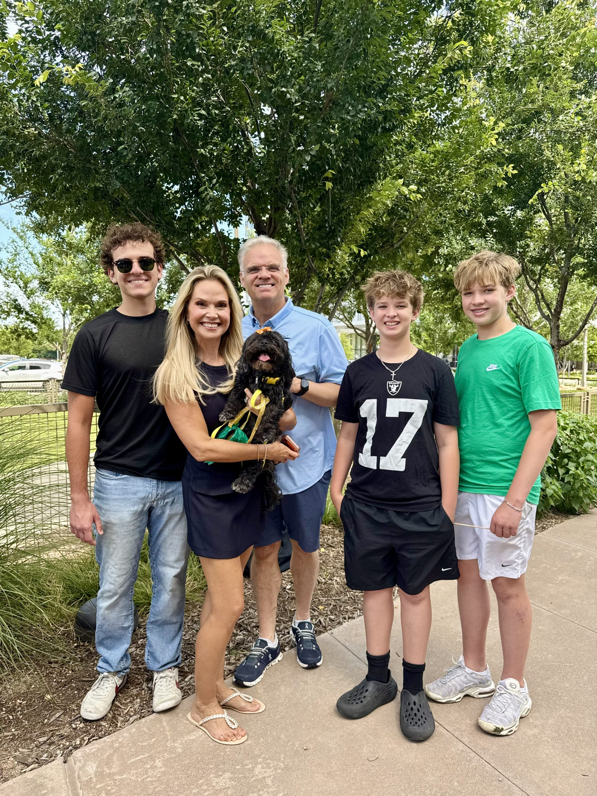 Christine Goodwin, Shane Goodwin, and family at the Happy FurEver Dog Park ribbon cutting in Frisco, Texas