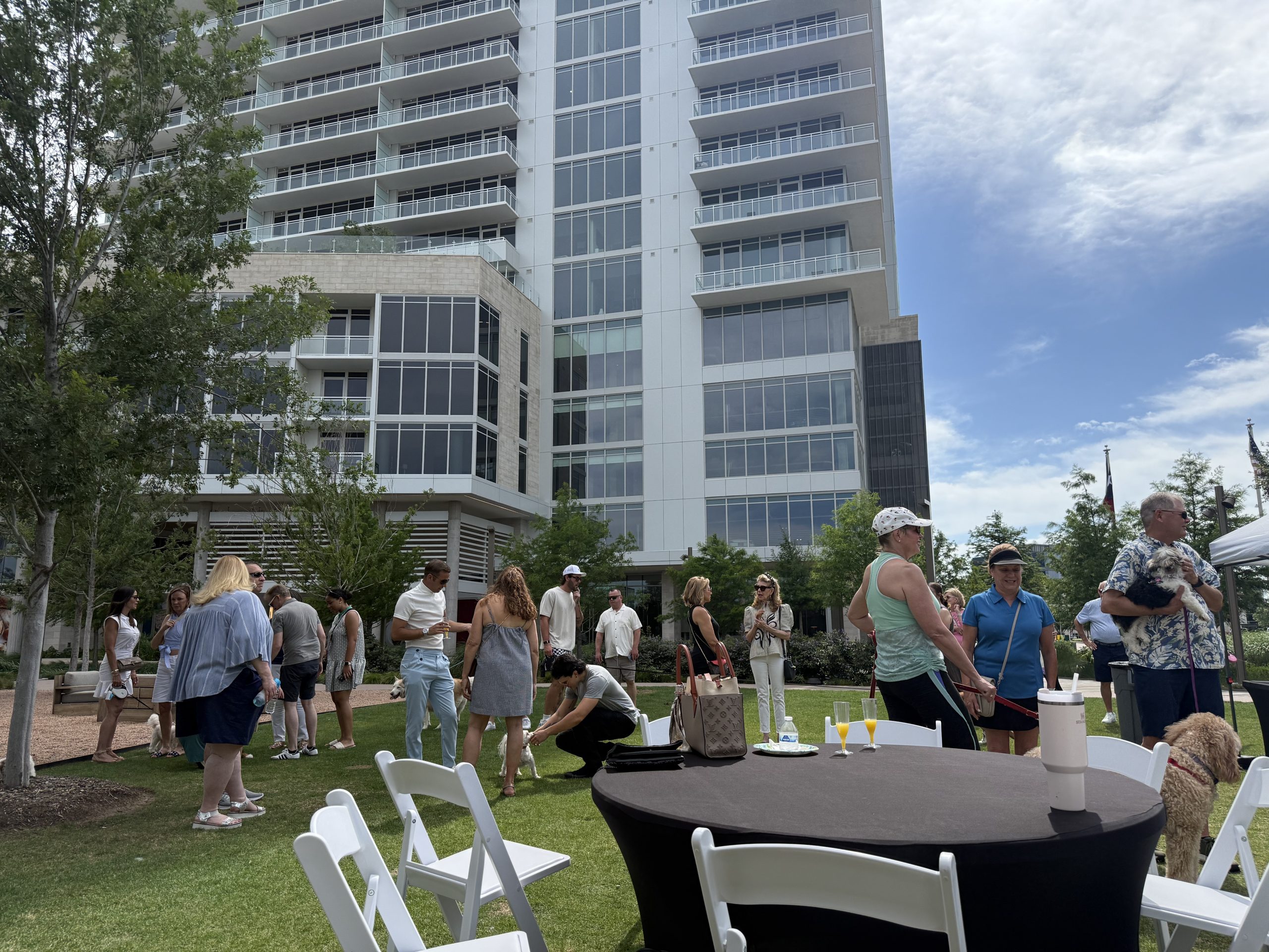 Community members gather at Kaleidoscope Park during the Happy FurEver Dog Park ribbon cutting in Frisco, Texas