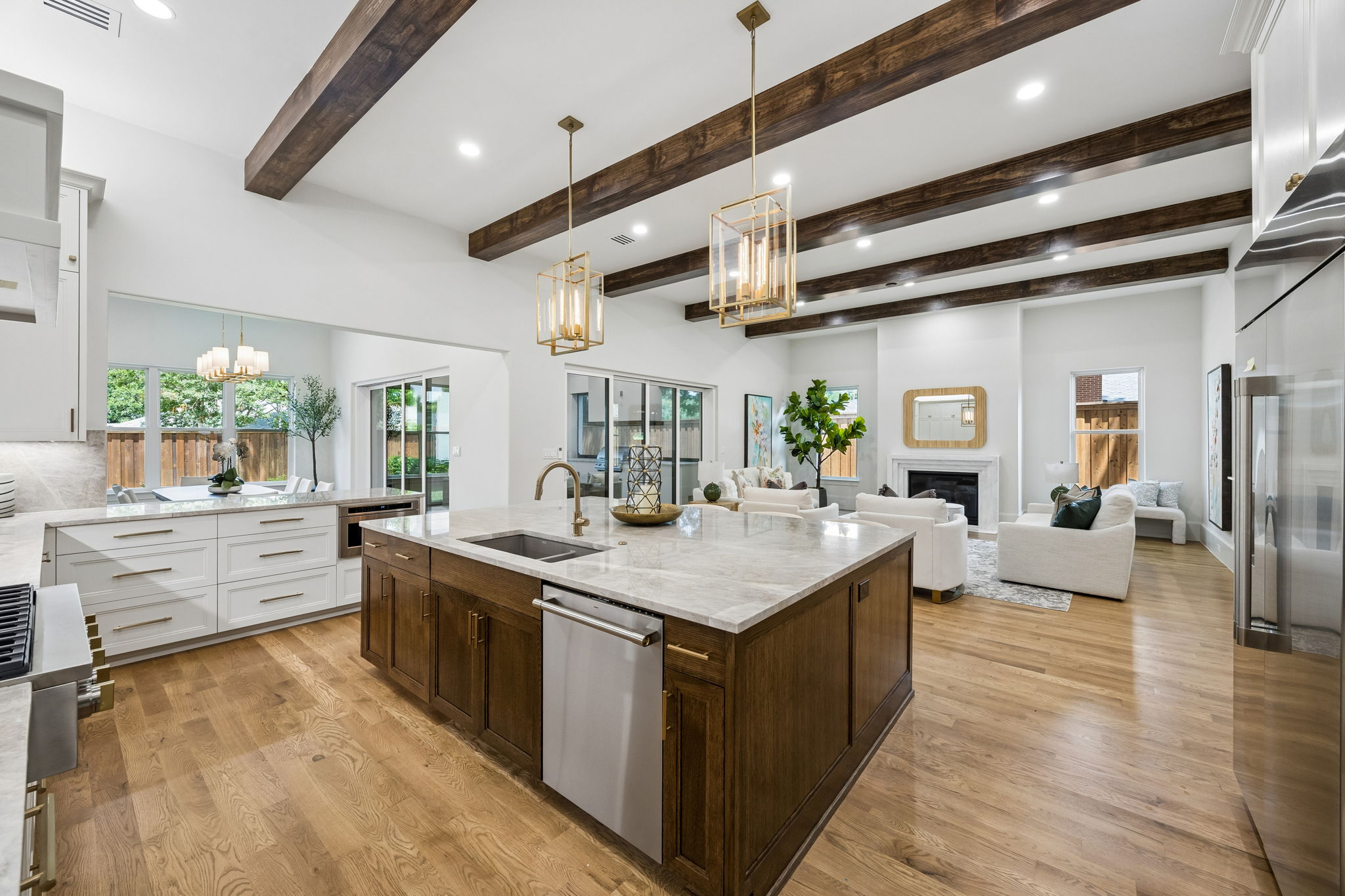 Kitchen overlooking living and dining room at 9939 Ontario Lane Dallas