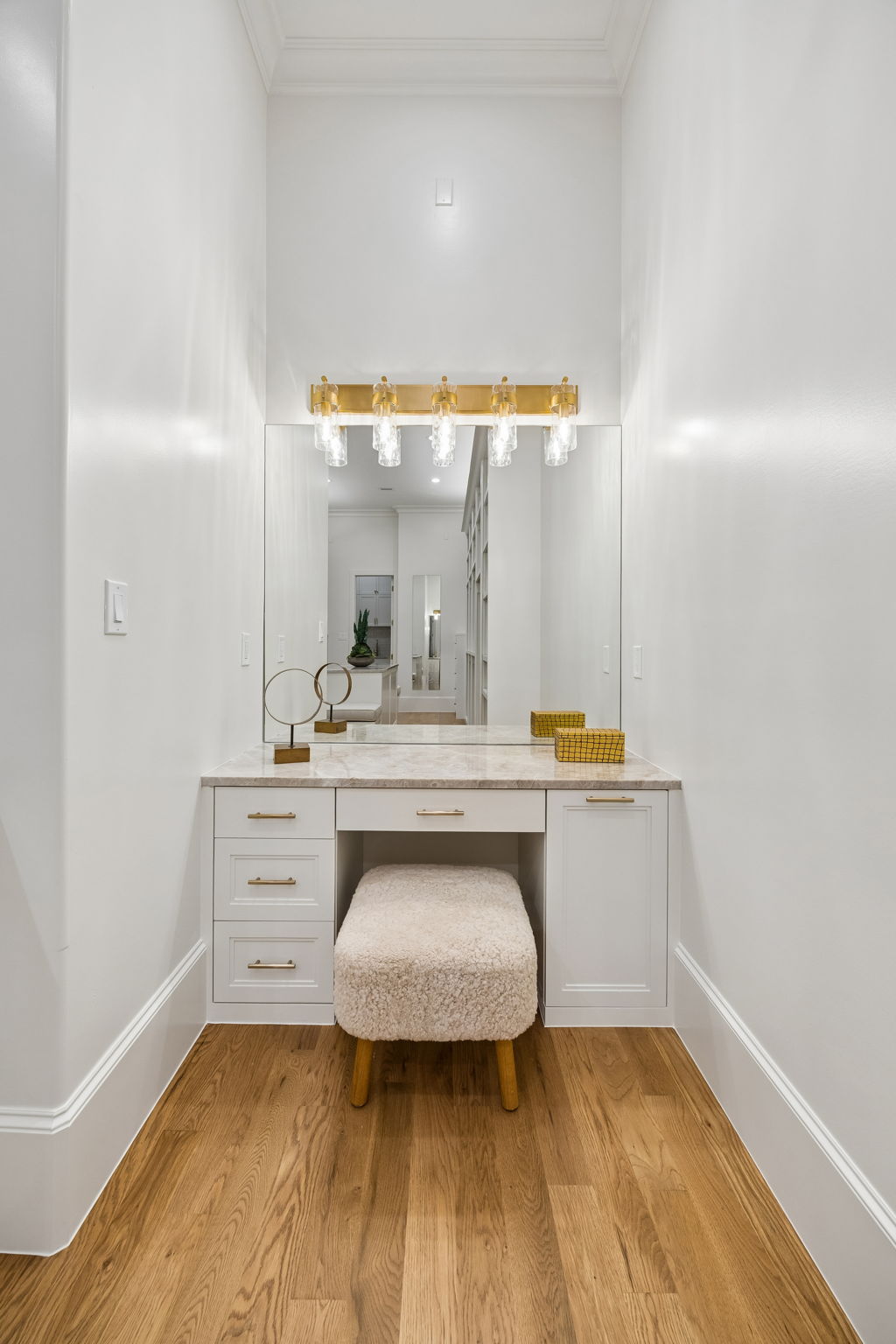 Built-in vanity in primary closet at 9939 Ontario Lane Dallas