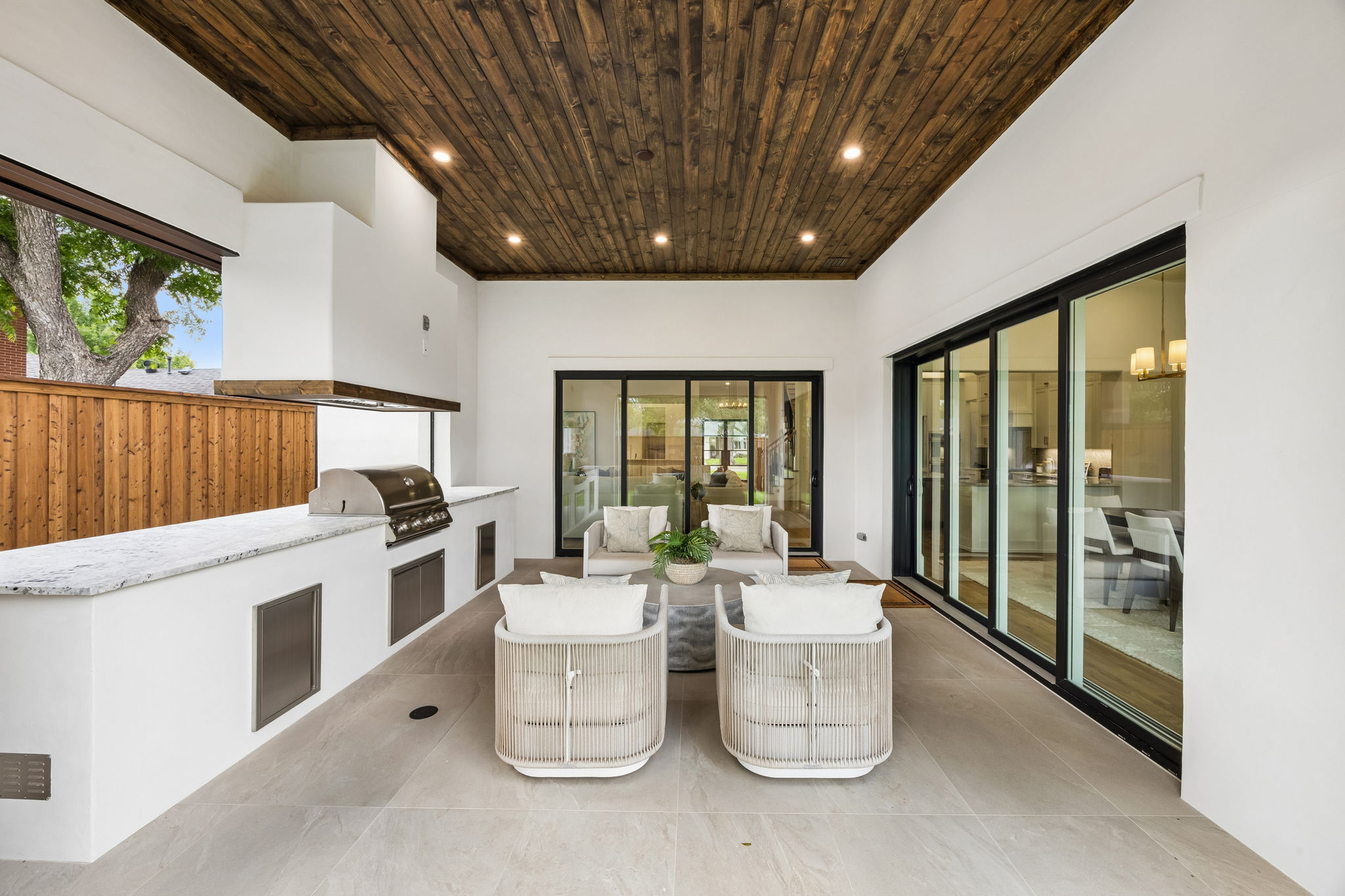 Covered patio with built-in gas grill at 9939 Ontario Lane