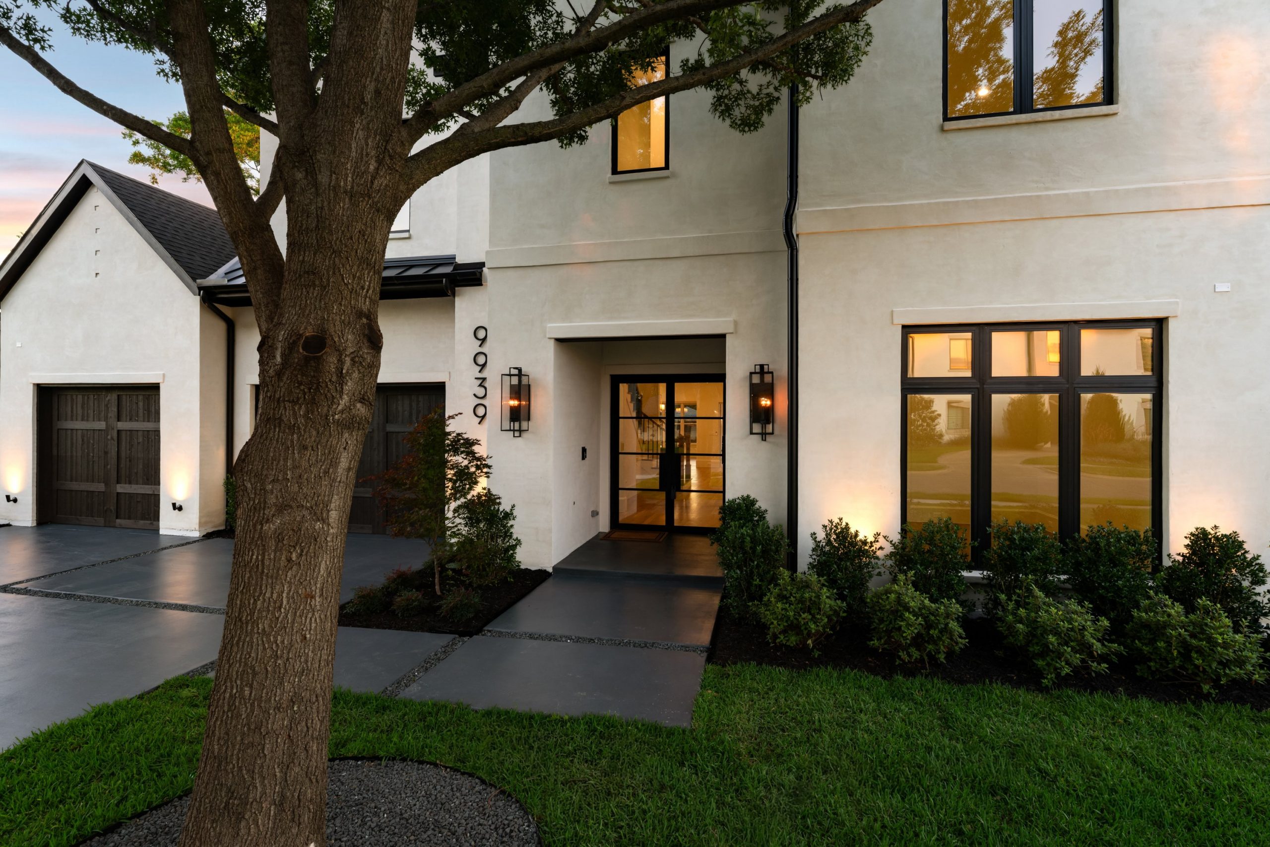 Front entry and garage of 9939 Ontario Lane luxury home in Dallas